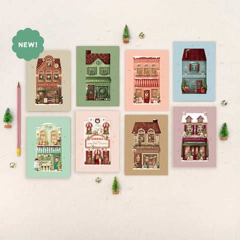 Hand‑illustrated Post Office, Mrs Claus’ Bakery, Florist, Stationery Shop, Ice Cream Parlour, Cinema, Bookshop and Cosy Clothing Co. greeting card – Studio Sue Designs